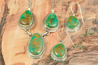 Genuine Crow Springs Turquoise set in Sterling Silver. Beautiful Necklace and Earring Set. Created by Navajo Artist Kathy Yazzie. Signed by the artist. The Crow Springs Mine is located near Tonopah, Nevada.